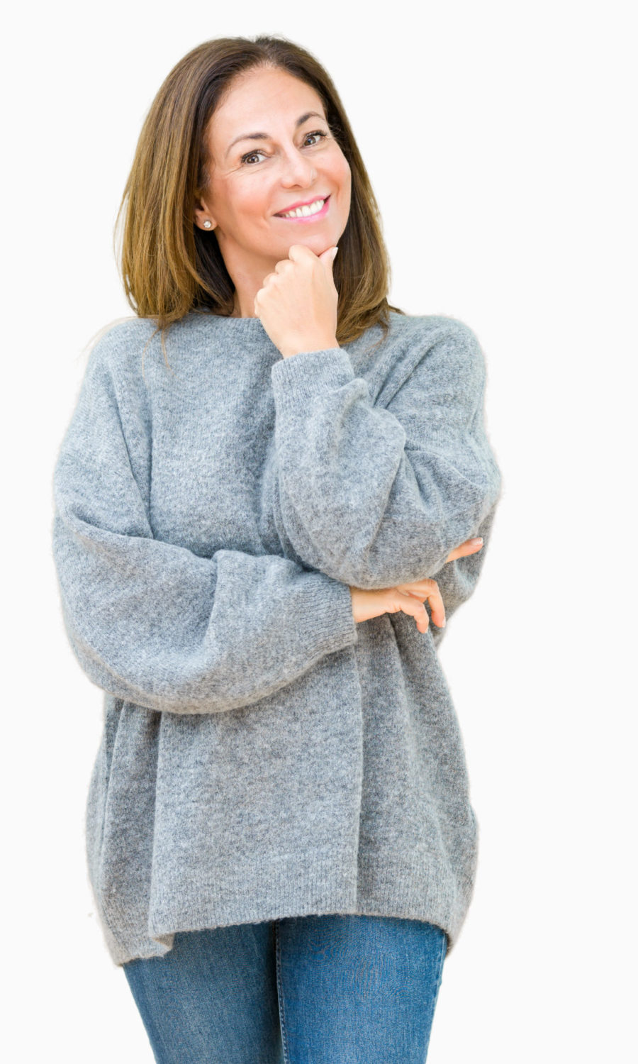 Beautiful middle age woman wearing winter sweater over isolated background looking confident at the camera with smile with crossed arms and hand raised on chin. Thinking positive.